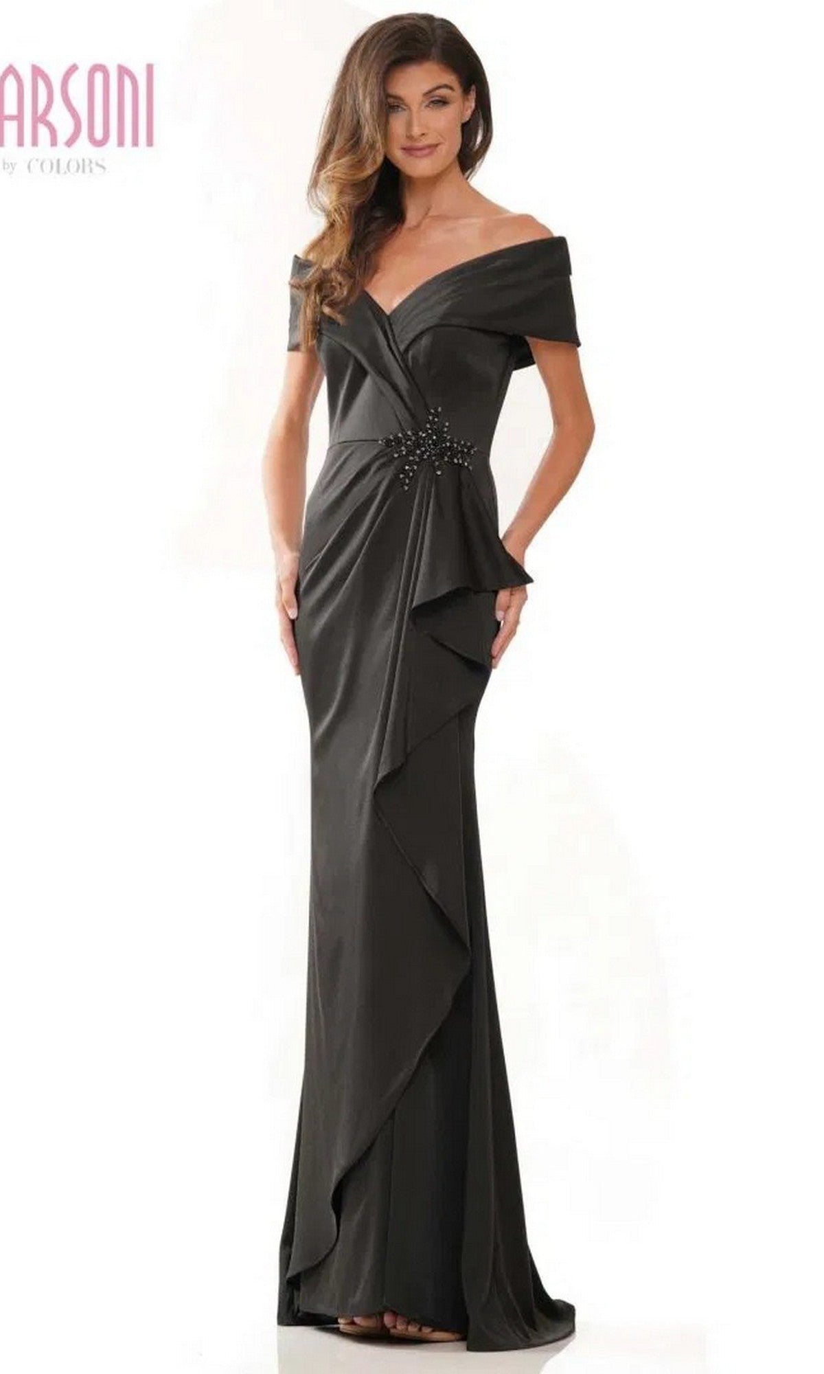 A woman wearing the Marsoni MV1180, a black long formal dress featuring an off-the-shoulder design, floor-length hem, ruffled front detail, and beaded waistline for an elegant finish.